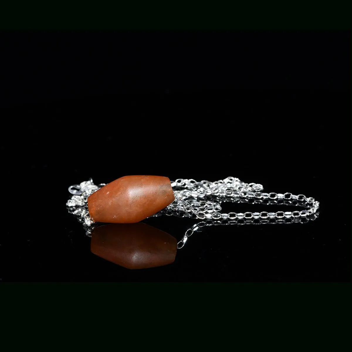 An Egyptian Carnelian Bead, Middle Kingdom, Dynasty 11- 12, ca. 2040 - 1786 BCE